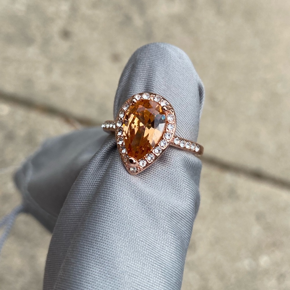 Woman’s orange sapphire ring